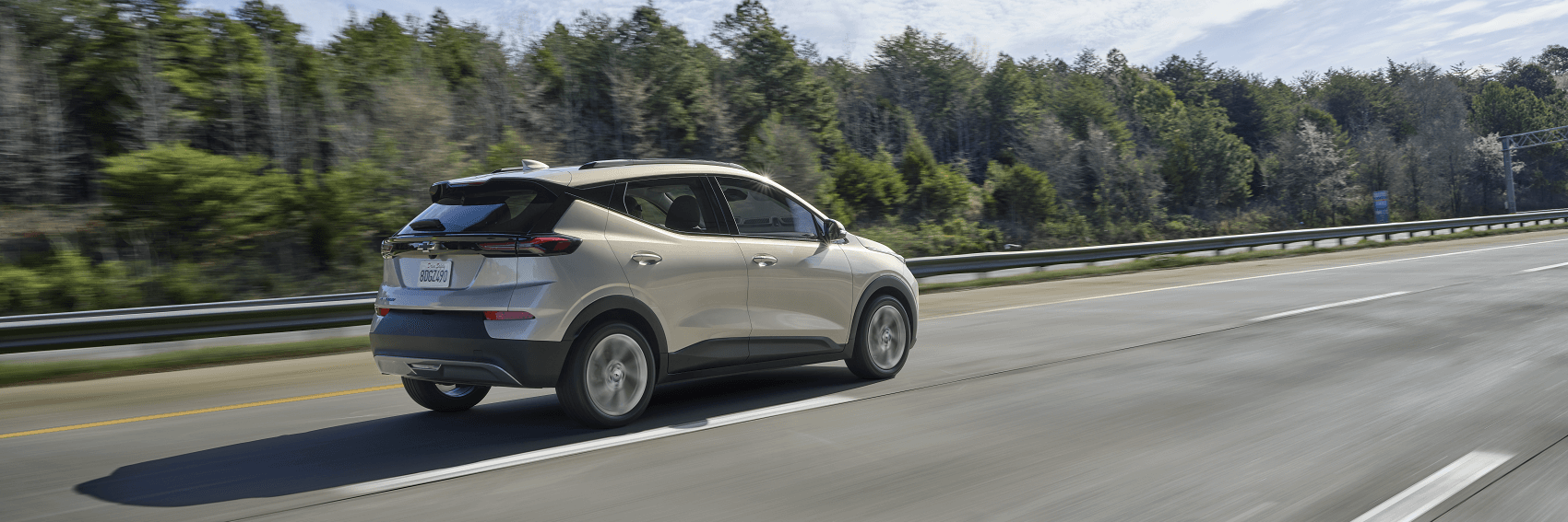 Beige Chevy Blazer drives on road near Lansing, Michigan